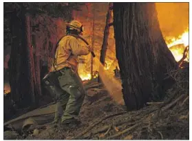  ?? Jason Armond Los Angeles Times ?? CREWS WORK a controlled burn in Strawberry, Calif., in August to battle the Caldor fire near South Lake Tahoe. Experts call prescribed burns “good fire.”