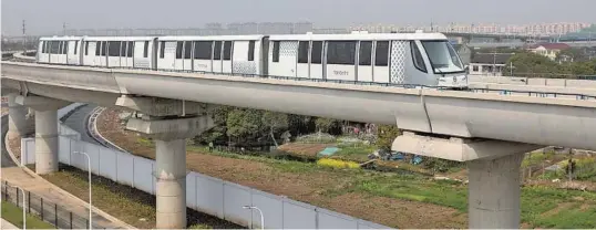  ??  ?? An automated train operates on trial runs ahead of the start of the new Pujiang Line service for commuters.