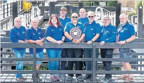  ?? ?? Members of the winning team from Tuel Lane Lock, Sowerby
Bridge. From left are: Tim Holroyd, Andrew Cottrill, Cath Munn, Gary Gigan, Ian Kelshaw with plaque, Bob Laycock, Richard Parfitt, Mike Brennan and Pete Burton.