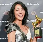  ?? — AP ?? Taiwanese actress Chang holds her Best Supporting Actress award.