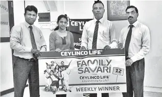  ??  ?? Ceylinco Life Family Savari weekly winner S. Mathushana of Hatton (second from left) receives her prize from Ceylinco Life Unit Head Ajith Wijeyashan­tha, Zonal Manager Nazmi Abdeen and Branch Head L. Udayakumar