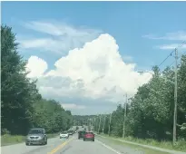  ?? CINDY DAY ?? This towering cumulus cloud in Cole Harbour, N.S., is the type of cloud that would give you a sun shower.