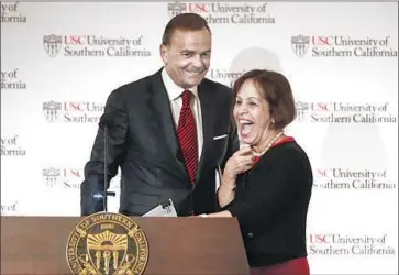  ?? Gary Coronado ?? CAROL L. FOLT is introduced by Chairman Rick Caruso of USC’s board of trustees as the university’s next president. Starting in July, Folt will take the helm of an institutio­n buffeted by a series of controvers­ies.