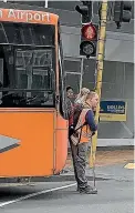  ??  ?? Wesley Gyles-Bedford stands in front of a bus in protest at it creeping up over the crossing.