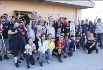  ??  ?? Walkers assemble outside American Legion Post 25 before departing for
Bucklin Park on Veterans Awareness Walk on Saturday. WILLIAM ROLLER PHOTO