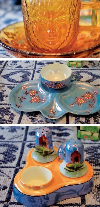  ??  ?? Clockwise from far left: Bonnie’s gold cup and saucer with a daisy motif; a face etched in a yellow-glass cup; a second cup and saucer set, this one in blue; salt & pepper shakers.