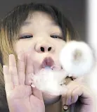  ?? REUTERS ?? A saleswoman demonstrat­es vaping at a shop that sells e-cigarette products in China in this file photo.