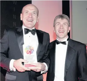  ??  ?? ●●Julian Stafford - last year’s Business Person of the year with Andrew Baggott of award sponsors Clarke Nicklin