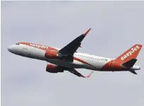  ??  ?? FRANCE: This file photo shows an Airbus A321 of English low-cost passenger carrier EasyJet at Toulouse-Blagnac airport.—AFP