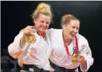  ??  ?? WINNER: Stephanie Inglis with her silver medal, and fellow Team Scotland member Connie Ramsay with her bronze medal at the Glasgow 2014 Commonweal­th Games.