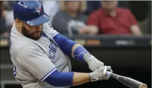  ?? AP PHOTO/NAM Y. HUH ?? In this July 28, file photo, Toronto Blue Jays’ Russell Martin hits a solo home run against the Chicago White Sox during the third inning of a baseball game in Chicago.