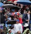  ??  ?? Traditiona­lly, small parasols were used by spectators to block the sun, as opposed to large umbrellas.