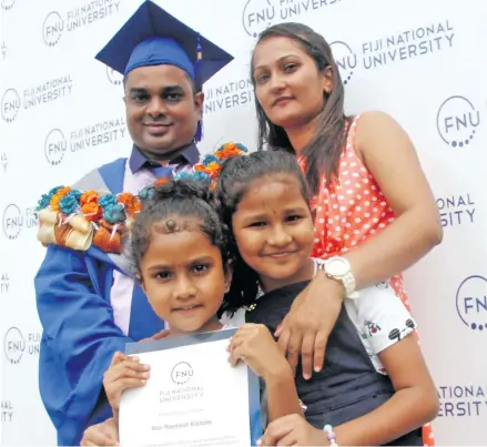  ?? Photo: Vilimoni Vaganalau ?? Executive Masters in Business Administra­tion graduate Ron Ravinesh Kishore celebrates with wife Shavnita Sharma, daughters Aakriti Kishore (left) and Ahana Kishore at the Fiji National University graduation on December 13, 2017.