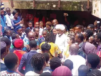  ??  ?? Soyinka surrounded by guests inside his Ijegba forest home