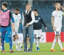  ?? EFREM LUKATSKY THE ASSOCIATED PRESS ?? Hoffenheim coach Julian Nagelsmann, centre, looks on at the end of a Group F Champions League soccer match against Shakhtar Donetsk in Kharkiv, Ukraine, on Wednesday. The teams played to a 2-2 draw.