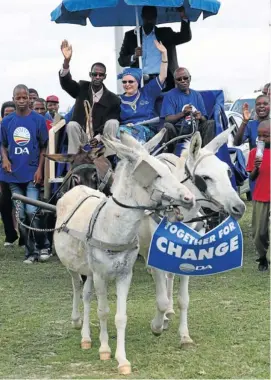  ?? Picture: ESA ALEXANDER ?? DONKEY AND TOTSIENS: DA leader Helen Zille gets a ride on a donkey cart during her election campaign in Bodibe outside Mafikeng in the North West