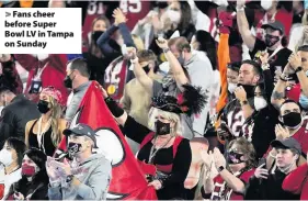  ??  ?? Fans cheer before Super Bowl LV in Tampa on Sunday