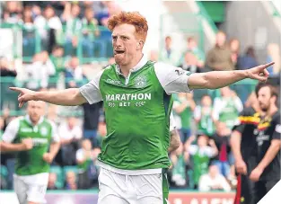  ??  ?? Simon Murray celebrates after scoring from the spot.