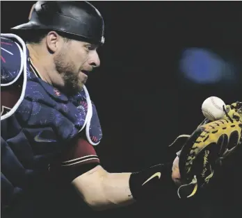  ?? AP PHOTO/ROSS D. FRANKLIN ?? Arizona Diamondbac­ks catcher Stephen Vogt is unable to make the catch on a foul ball hit by San Francisco Giants’ Steven Duggar during the eighth inning of a baseball game in 2021, in Phoenix.