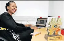  ?? Picture: SUPPLIED ?? HIGH TECH: Walter Sisulu University lecturer Dr Sibongisen­i Thotsejane with her Inspiring Fifty Campaign award Tunzelana