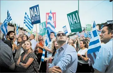  ?? CHRISTOPHE­R FURLONG/GETTY ?? Supporters of terms offered by internatio­nal creditors listen to speeches during a “yes” rally Friday in Athens. Thousands of opponents of the terms attended a “no” rally about a half-mile away as the nation prepared for a referendum Sunday.