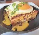  ?? BARE BONES GASTROPUB/PROVIDED ?? Bare Bones Gastropub has been testing menu items that could show up on the menu at Burn ‘Em Brewing in Michigan City in the coming weeks. The gastropub is a sister business owned by the Burn ‘Em partners. This is an andouille cornbread jalapeño bread pudding with hollandais­e and sunny side farm fresh egg.