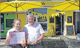  ??  ?? Right: Staff member Anja Powell and café owner Robert McKay showing off the Eatery of the Year Awards. 15_T23_ little bay awards_ Robert and Anja with awards