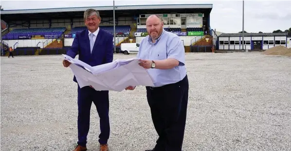  ??  ?? Councillor Mark Deaville, left, and Leek Town chairman Jon Eeles review the plans at Harrison Park.