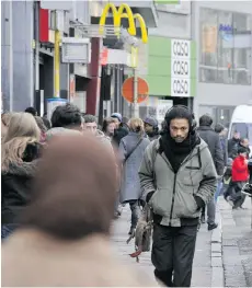  ?? GEORGES GOBET/AFP/GETTY IMAGES ?? Pedestrian­s crowd a sidewalk in the Matonge district of Brussels. Some in the community feel Arabs living in the city are unjustifia­bly using victimizat­ion as an excuse to spread violence.