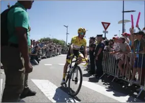  ?? THIBAULT CAMUS - THE ASSOCIATED PRESS ?? France’s Julian Alaphilipp­e wearing the overall leader’s yellow jerse arrives for the start of the fifth stage of the Tour de France cycling race over 175.5 kilometers (109 miles) with start in Saint-Die-Des-Vosges and finish in Colmar, Wednesday, July 10, 2019.