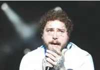  ?? (Bernadett Szabo/Reuters) ?? POST MALONE performs on the main stage during the Sziget music festival on an island in the Danube River in Budapest, last month.