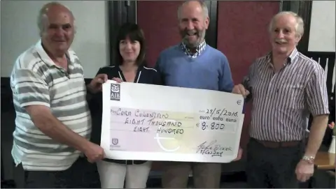  ??  ?? Cora Coleman, recent jackpot winner in the Kildavin/Clonegal GAA lotto was presented with her cheque for €8,800 Conway’s Lounge, Kildavin. Pictured are: (from left) Johnny Dunne, Cora Coleman, P.J. Conway and P.J. Kavanagh.