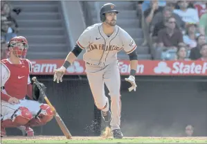  ?? MARK J. TERRILL — THE ASSOCIATED PRESS ?? The Giants’ Steven Duggar runs as he watches his RBI double during the 12th inning Wednesday.