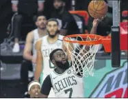  ?? KIM KLEMENT ?? Boston Celtics guard Jaylen Brown (7) shoots the ball during the first-round playoff series against the Philadelph­ia 76ers in Lake Buena Vista, Fla.