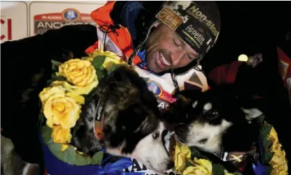  ??  ?? Thomas Waerner celebrates in Nome after winning this year’s Iditarod. Photograph: Marc Lester/AP