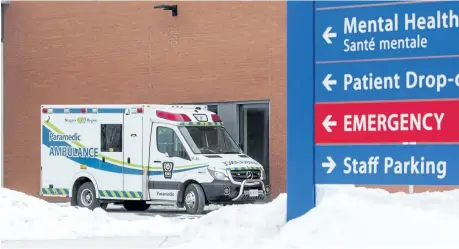  ?? BOB TYMCZYSZYN/STANDARD STAFF ?? An ambulance parks outside the emergency doors at St. Catharines hospital Tuesday. Last year Niagara paramedics spent 15,438 hours waiting outside emergency department­s unable to deliver patients due to a lack of emergency room beds.