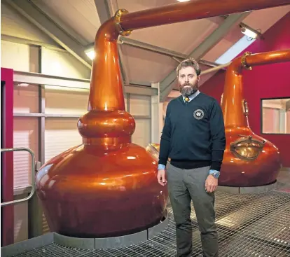  ??  ?? Glen Wyvis founder and managing director John Mckenzie at the community-owned distillery, Scotland’s first