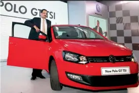  ??  ?? Arvind Saxena, managing director of Volkswagen passenger cars, poses for the media during the launch of the new Polo GT TSI car in Mumbai on Monday.