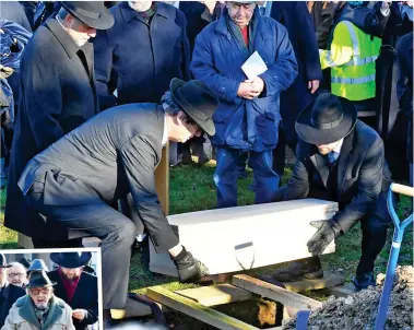  ??  ?? Resting place: A coffin with the remains of six victims is buried