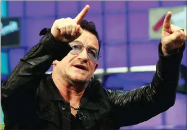  ?? PAUL FAITH/AFP ?? U2 frontman Bono speaks on centre stage during the last day of the Web Summit in Dublin, Ireland, in November 2014. More than 2,100 startups exhibited at the three-day networking event, alongside some of the industry’s leading companies, such as...