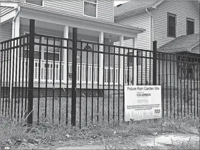  ?? [MARK FERENCHIK/DISPATCH] ?? A sign on Genessee Avenue in North Linden marks the site of a future rain garden.