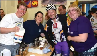  ??  ?? Volunteers Abina O’Connor Valentia Hospital, Jacinta Bradley Recovery Haven and Niamh Quinlan Down Syndrome with cyclist John Murray Tralee at the Ring of Kerry Charity Cycle Cahersivee­n station on Saturday.Photo by Michelle Cooper Galvin