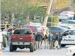  ??  ?? TROUBLING ATTACK: FBI investigat­ors work near the scene of Wednesday’s shooting in Thousand Oaks.