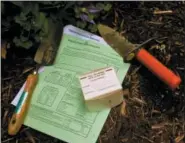  ?? BY DEAN FOSDICK — THE ASSOCIATED PRESS ?? This undated photo taken on a property near New Market, Va., shows a representa­tive soil test kit provided by the Cooperativ­e Extension Service designed to help gardeners determine whether or how to amend their landscapes for planting. Once a soil sample is taken, the kit is sent to a state university lab where it is analyzed and the results reported to the gardener. A modest fee is charged for the service. Cooperativ­e Extension remains the local outlet for unbiased, science-based informatio­n in rural counties.