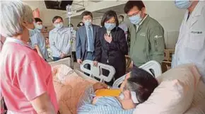  ?? EPA PIX ?? President Tsai Ing-wen visiting a survivor yesterday from a train that derailed a day before in a tunnel north of Hualien County, eastern Taiwan.