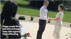  ??  ?? Happy couple David and Julie exchange vows with registrar Hazel officiatin­g