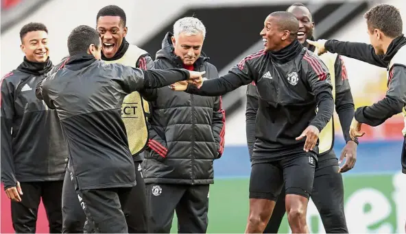  ??  ?? Fun time: Manchester United players horsing around in front of manager Jose Mourinho (centre) during a training session in Moscow yesterday. United face CSKA Moscow in the Champions League today. — AP