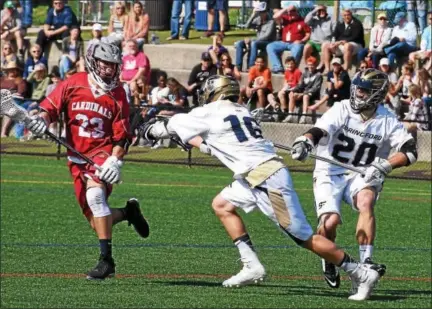  ?? ANNE NEBORAK — DIGITAL FIRST MEDIA ?? Upper Dublin’s Nicholas Vernacchio is stopped by Spring-Ford’s Daniel Cassidy and Daniel Doughtery on Saturday at the Katie Samson Festival.