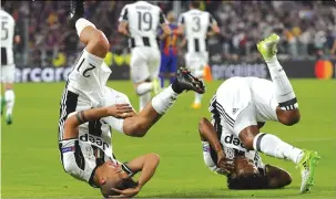  ??  ?? Dybala and Juan Cuadrado (right) try something a little different after the striker put the side 1- 0 up early on