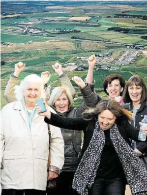  ?? Photograph: Kami Thomson ?? CELEBRATIO­N: Blackdog villagers Nicola Brown, front, with, from left, Edna Booth, Beth Jeffrey, Elaine Giubarelli and Janice Robertson celebrate the decision to reject the substation at Blackdog.
